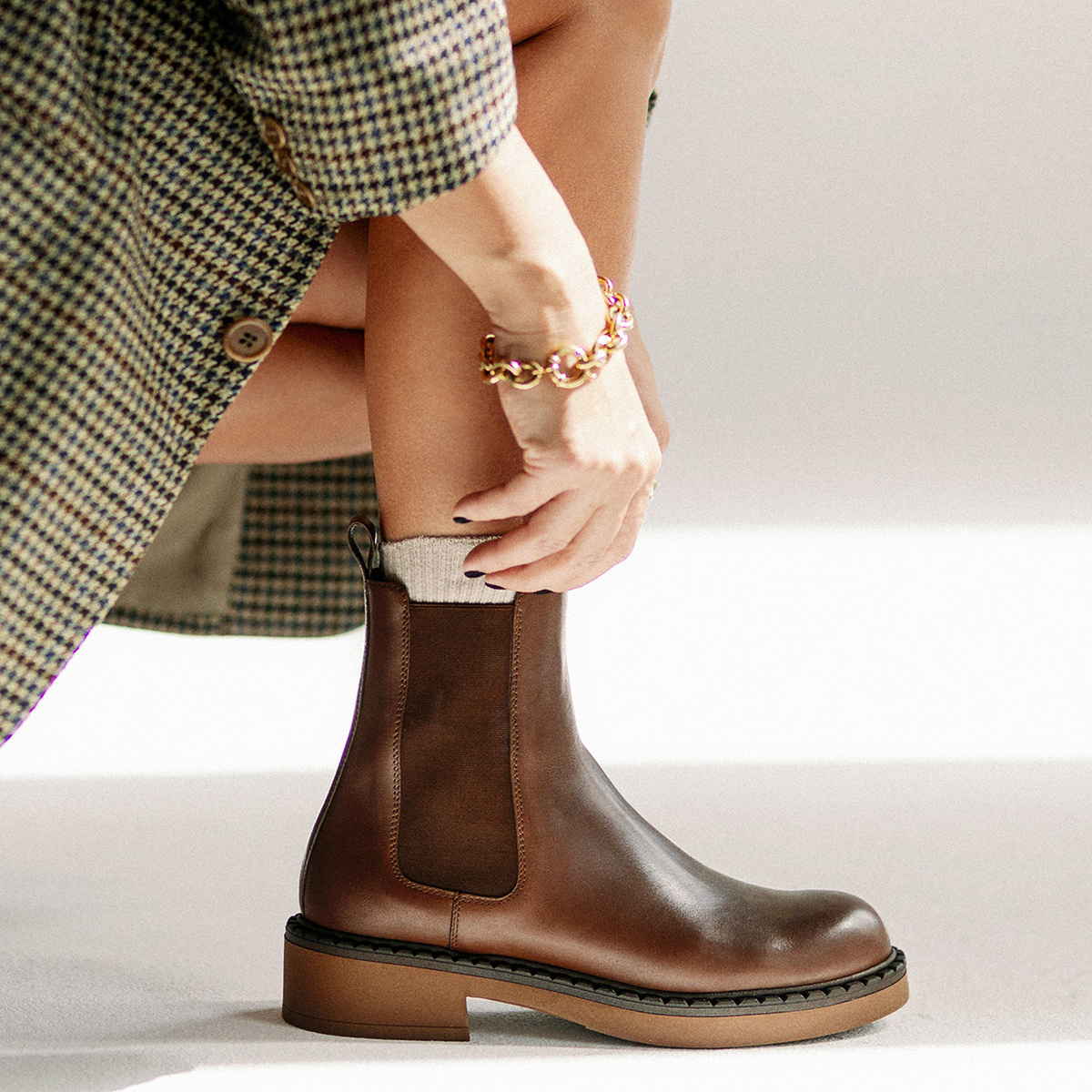 Brown Chelsea boots with a thicker sole